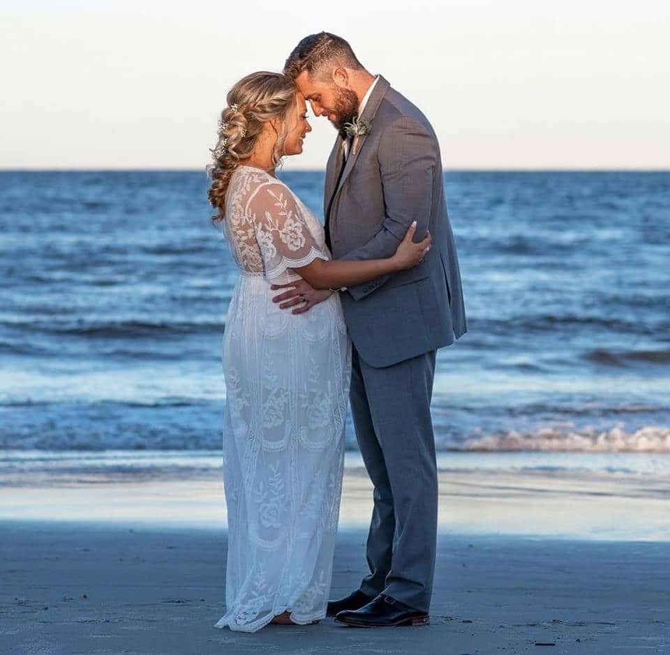 bride and groom just married on the beach at Hampon Inn Jacksonville Beach