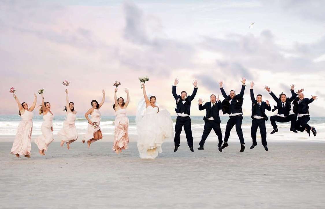 Wedding Party jumping on the beach at Hampon Inn Jax Beach Hampton Inn Jacksonville Beach Premier Bride Jacksonville