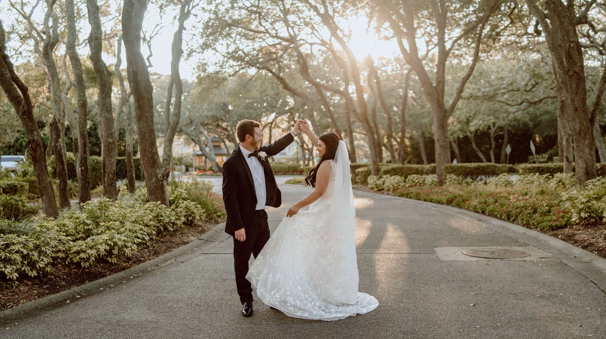 A bride and groom dancing in the live oak trees at The Golf Club of Amelia Island - Premier Bride 904