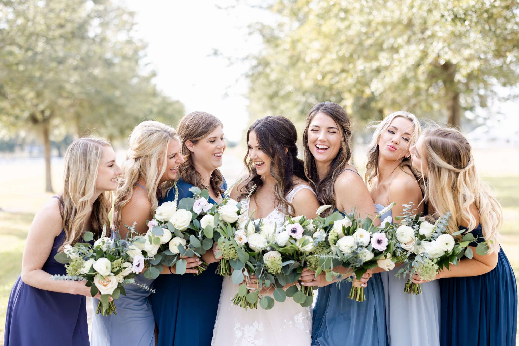 Bride and her bridesmaids in shade of blue Updos for I Dos in Jacksonville