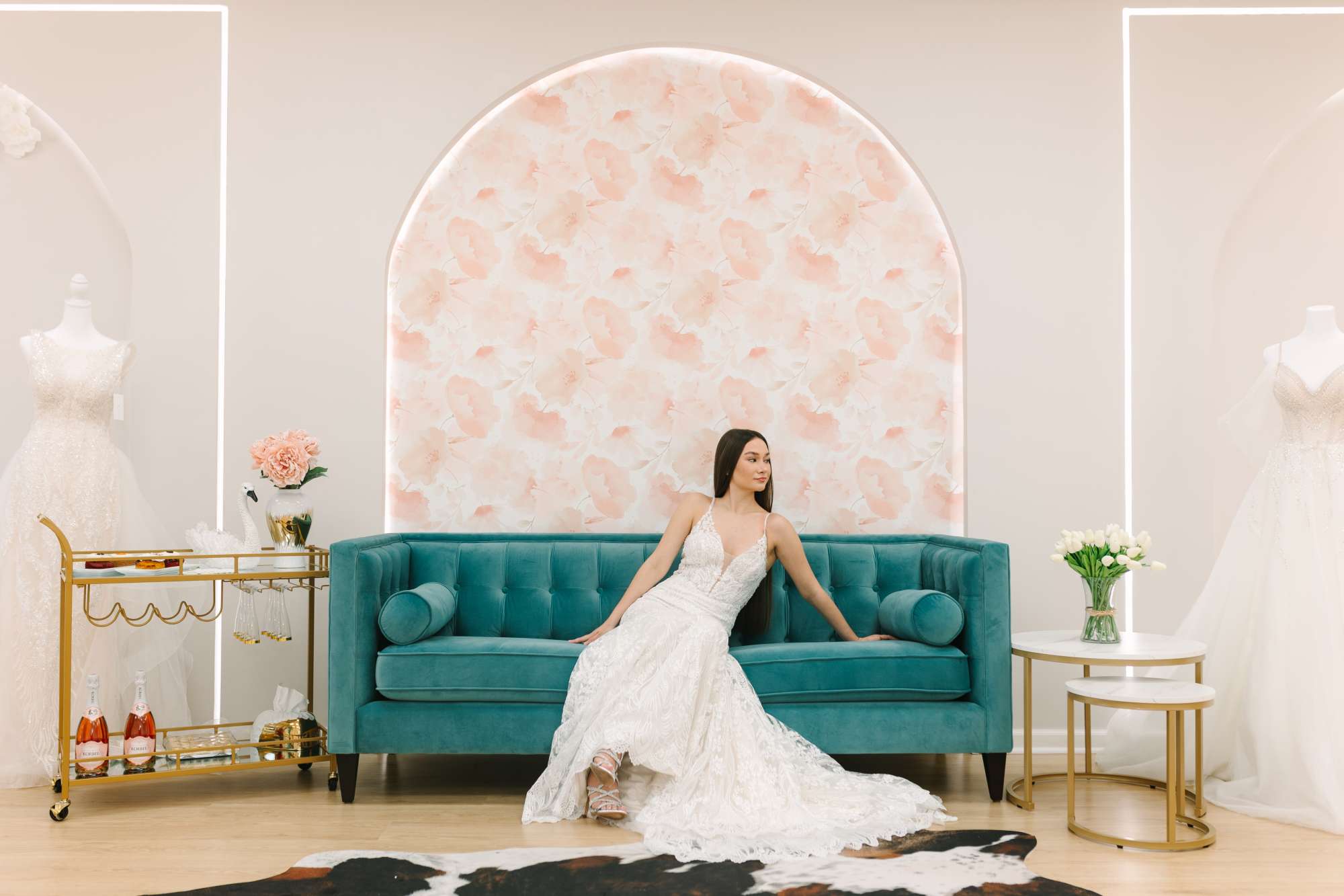 Be That Queen Bridal Salon bride on a teal couch Be That Queen Bridal Salon bride on a teal couch