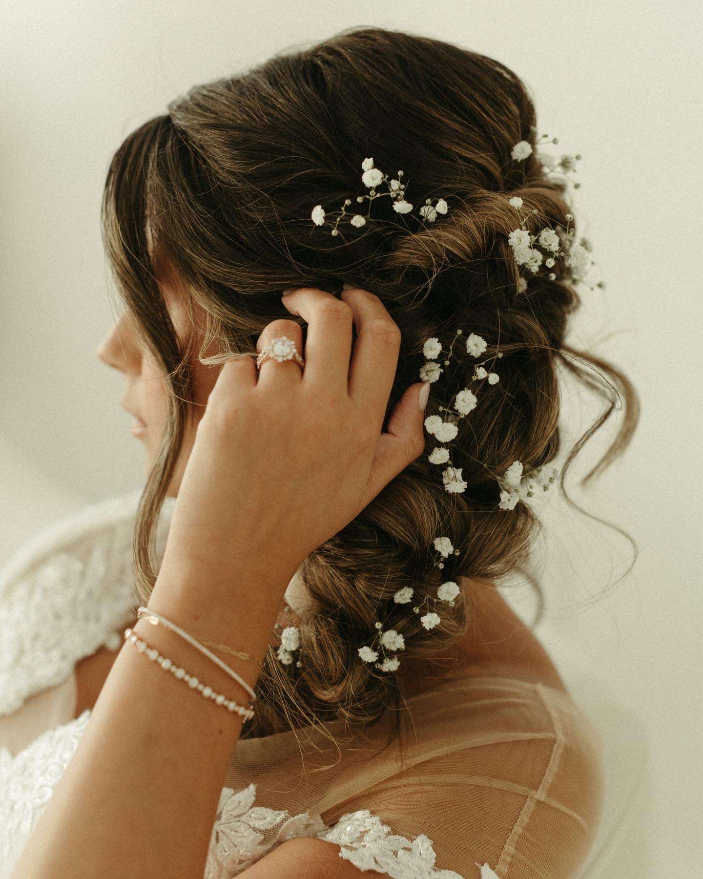 braided wedding hair style with curl wink blush Premier Bride