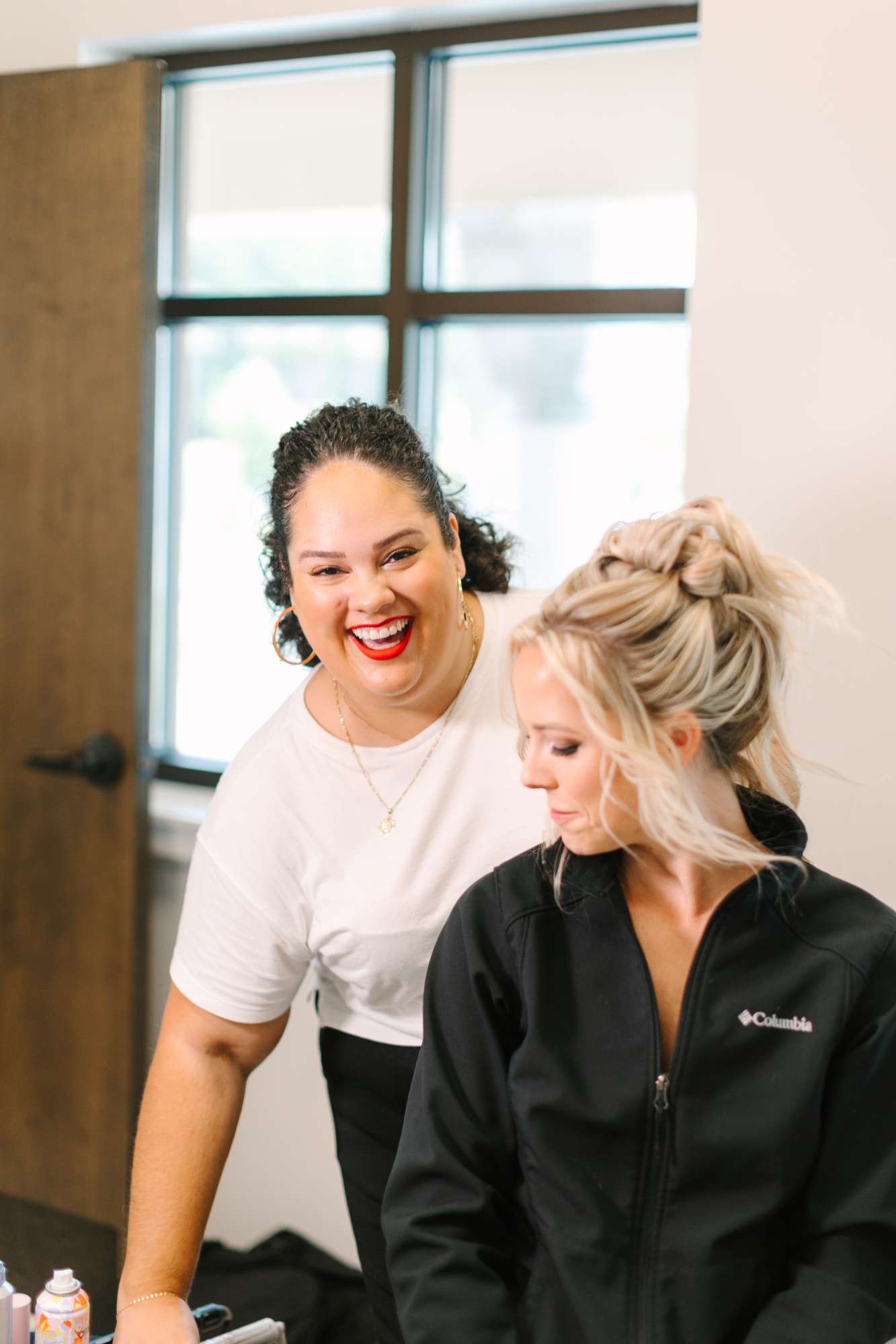 Curl Wink Blush owner Zulmarie with bride at fashion shoot