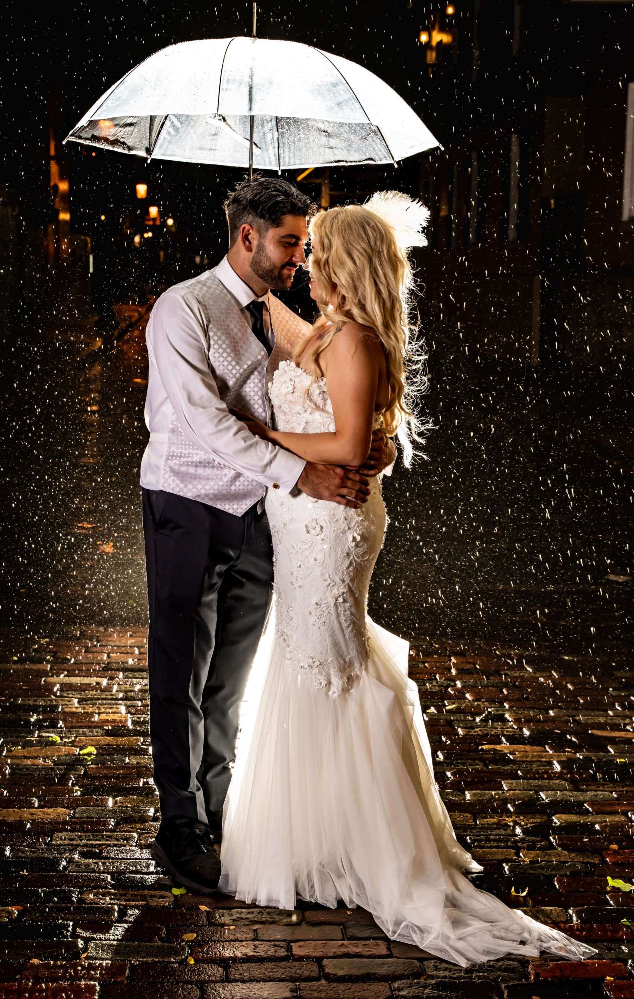 Bride and groom dancing in the rain at night - Breathless Imagery and Premier Bride