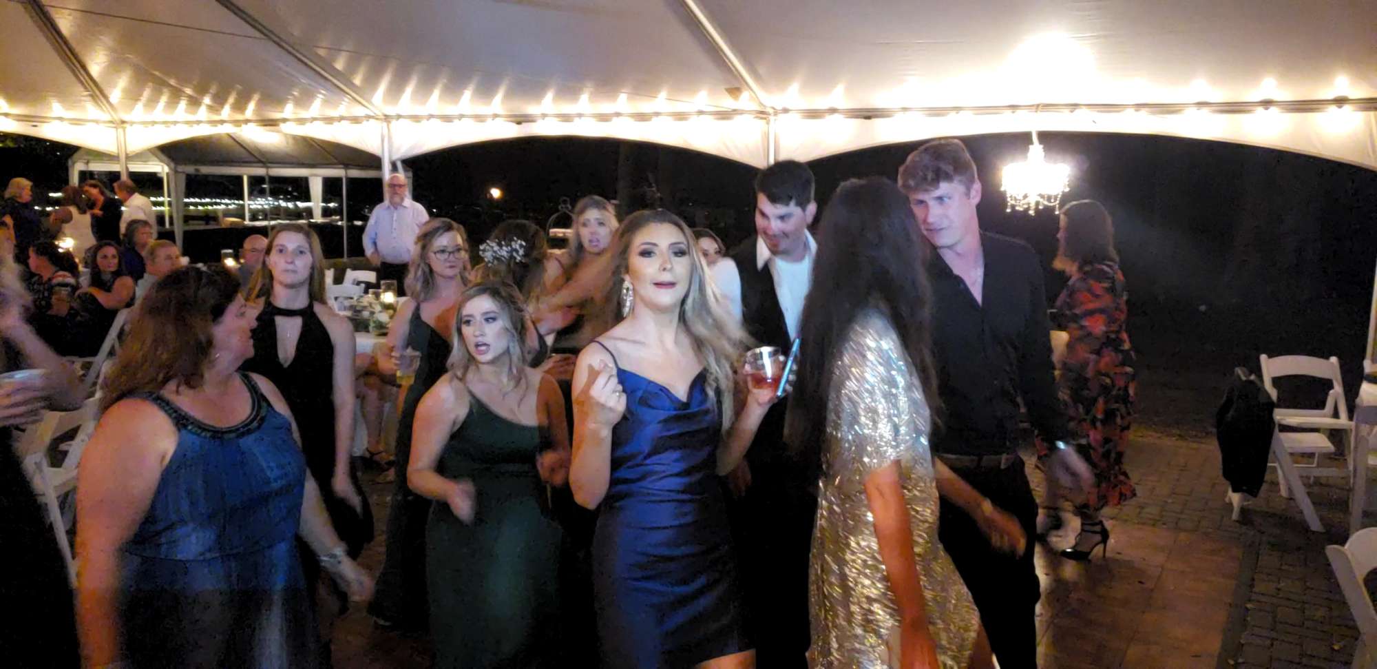 Dancing under a tent at a wedding in orida - Music by Vince