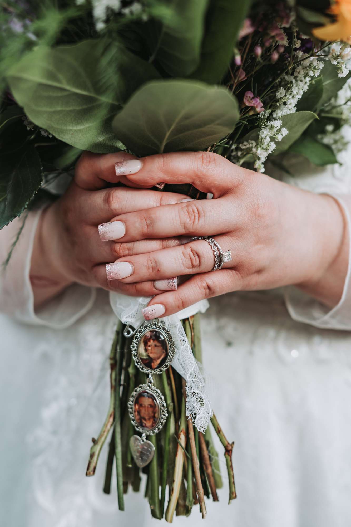 Remembering lost loved ones with pictures in wedding bouquet. Chez Entertainment