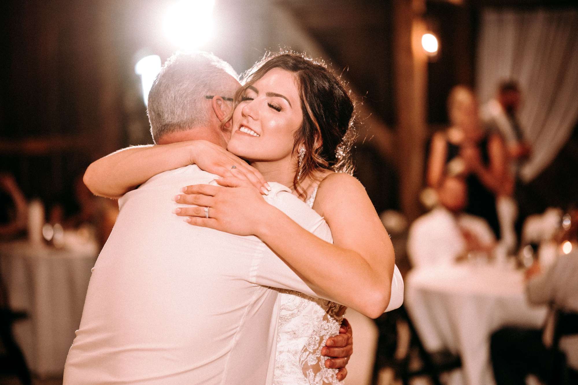 A hug from the bride and her dad at the daddy daughter dance with Island Sound