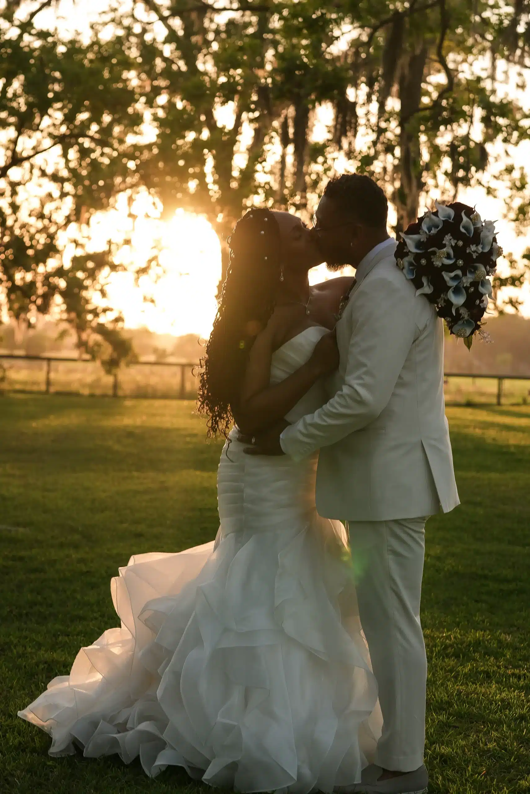 BEBO Wedding Photography bride and groom kiss at sunset on a farm BEBO Wedding Photography bride and groom kiss at sunset on a farm
