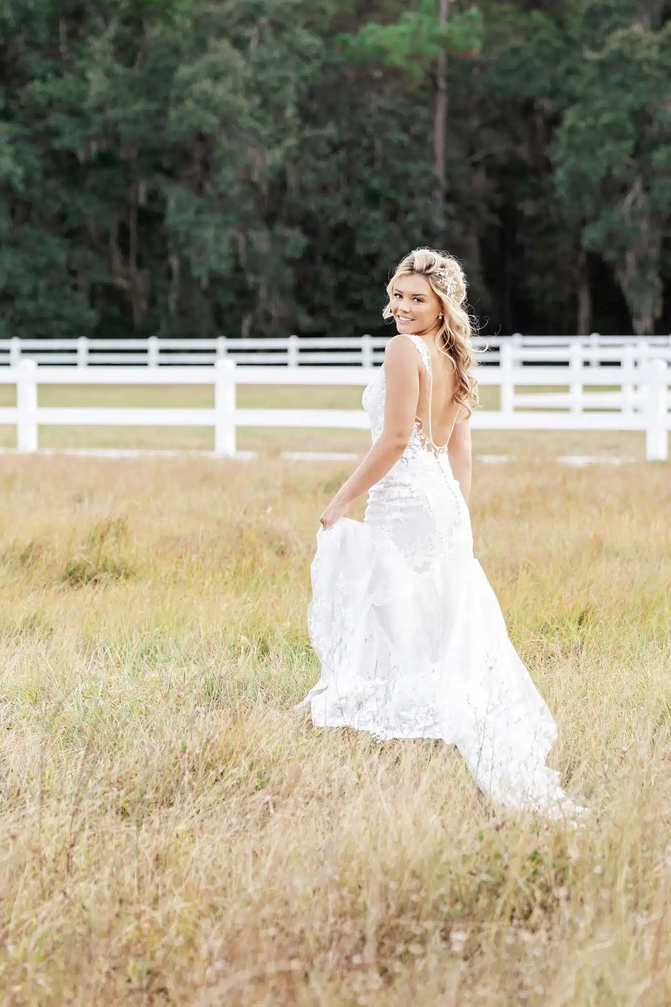 Callahan bride in a field with white fence NS Photobook Wedding Callahan bride in a field with white fence NS Photobook Wedding