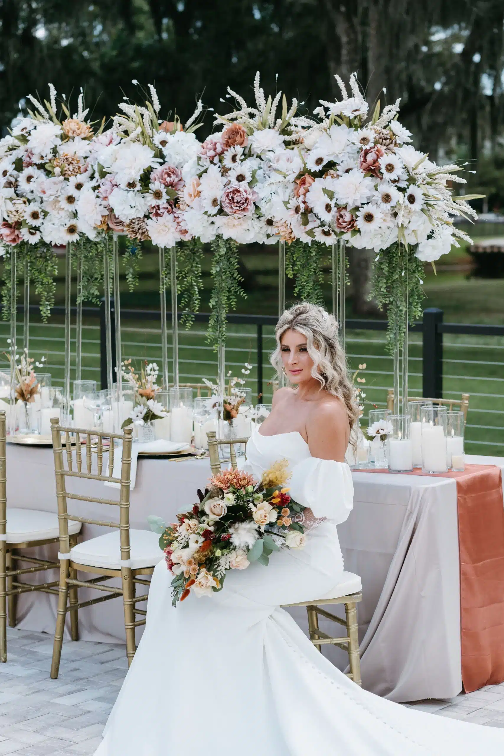 bride with a Desert Dreams wedding table scape by Florida Wedding Supply